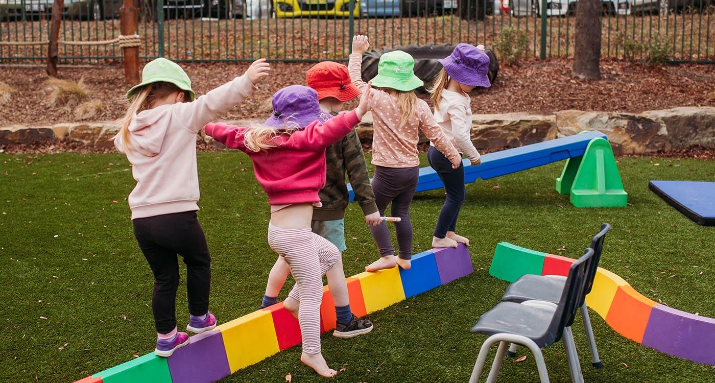 children having fun balancing